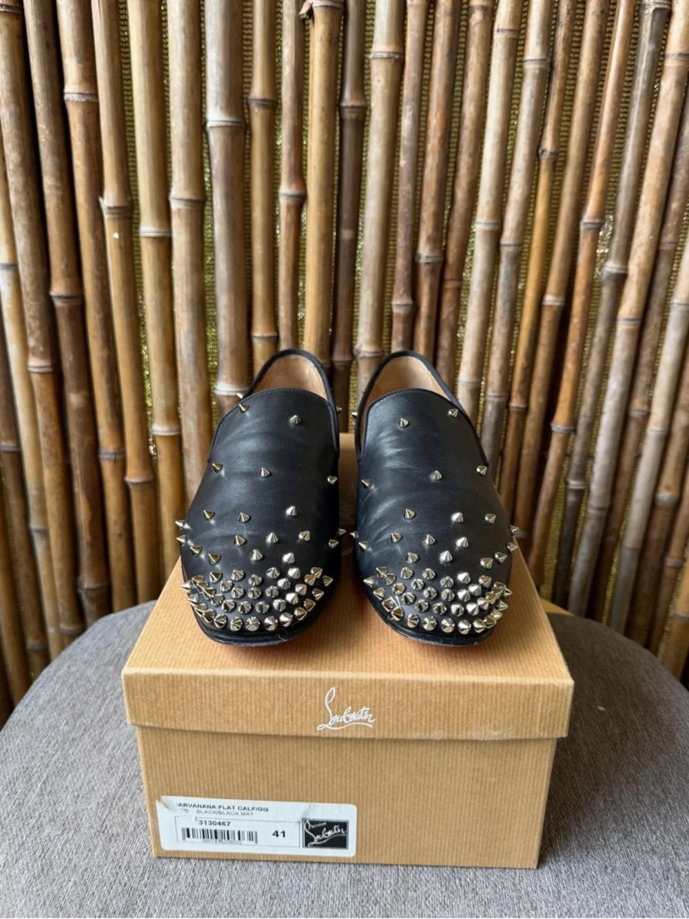 CHRISTIAN LOUBOUTIN men’s spiked leather loafers.